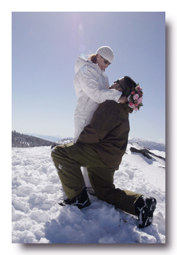 Groom kneeling by his bride on Heavenly Mountain