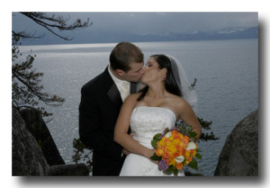 Bride and groom kissing on the vista point