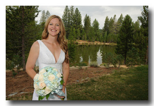 Closeup of bride in front of lake