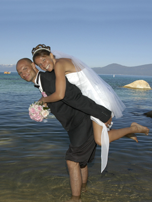 Bride riding piggyback on the groom