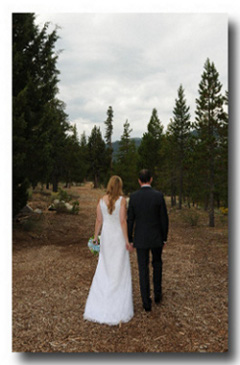 Groom and his bride walking away holding hands