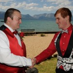 The groom shakes the hand of his best man