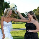 Bride playing with the bridesmaid