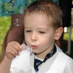 Ring bearer blowing bubbles