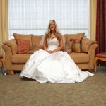 Bride sits on the couch prior to the walk