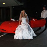 Posing by the car at night before departing the reception