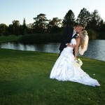 Groom dips his bride gracefully backwards