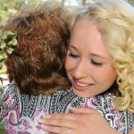 Affectionate hug from bride