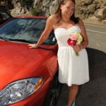 Posing by the car with her bouquet