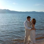 The two just married and are standing in the lake hugging