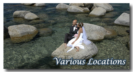 Bride and groom sitting on a rock in the water at Sand Harbor