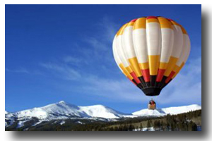 The balloon floats gently across the countryside