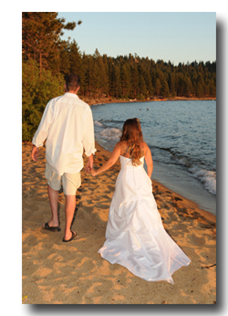 Bride and groom walking along the Tahoe shore