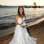 Bride poses for the photographer as the sun sets