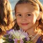 Flower girl displays a pretty smile