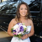 Bride poses next to the parked limo