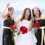 The bridal party display happy smiles