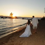 The married couple walk into the sunset after their wedding