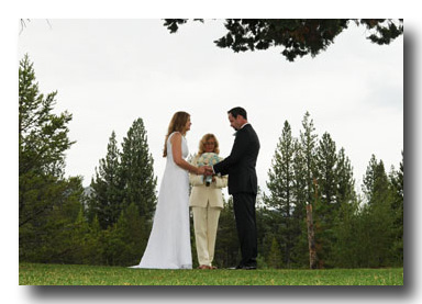 Bride and groom pray after exchanging their wedding vows