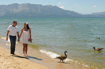 Strolling on the beach after their wedding