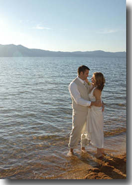 Groom standing in the water with bride