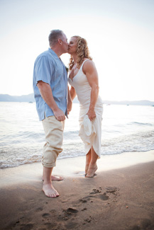 Bride and groom have first kiss on the sand