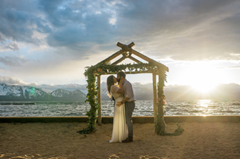 A ceremony being conducted at the shoreline of Lakeside Beach.